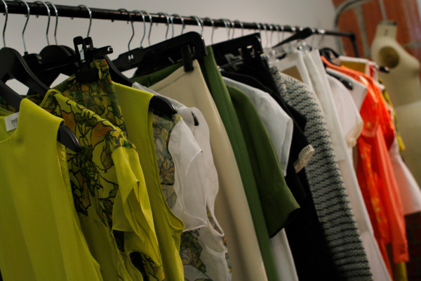 Vosovic's Spring 2013 collection was picked up by 23 new stores. Some of its samples hang on racks inside his studio.